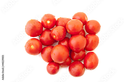 wet cherry tomatoes on a white background