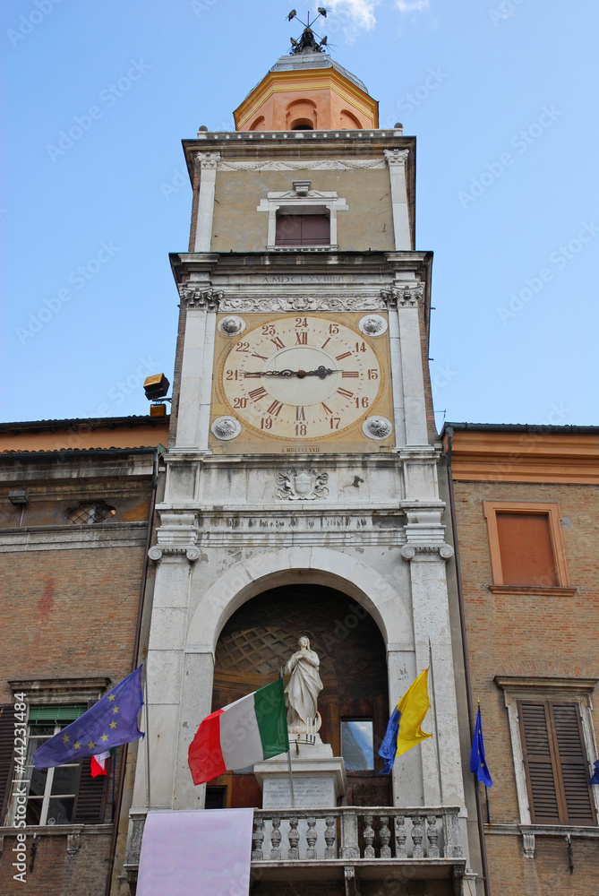 Obraz premium Italy, Modena Piazza Grand clock in the city hall building.