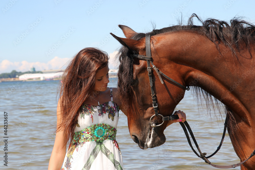 Obraz premium Girl with brown horse