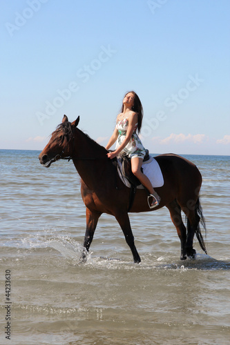 Woman with big brown horse