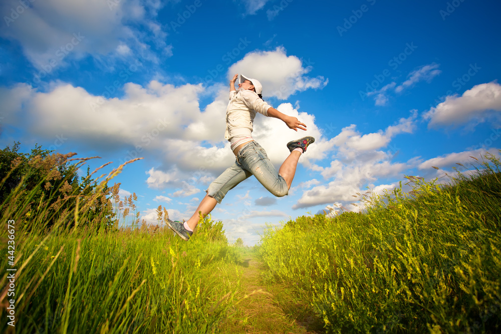 woman jumping over the blue sky woman jumping over the blue sky