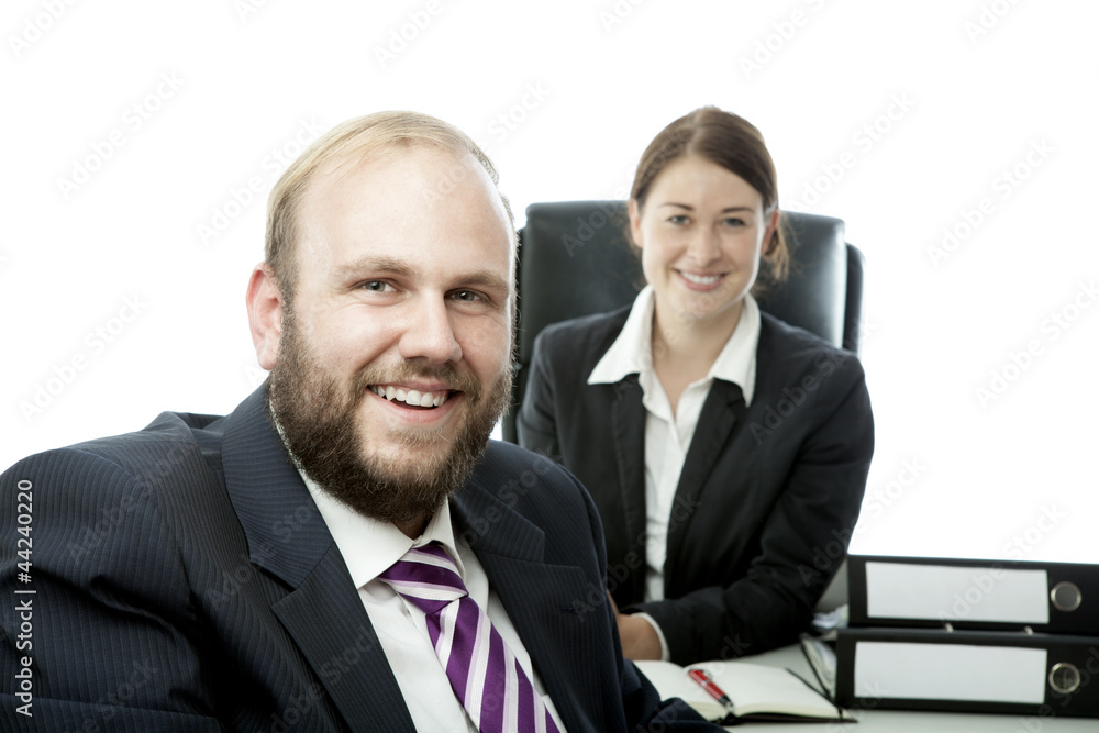 beard business man brunette woman at desk smiling beard business man brunette woman at desk smiling