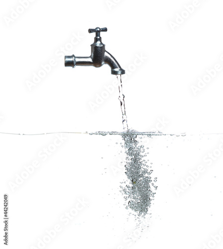 faucet with water and bubbles