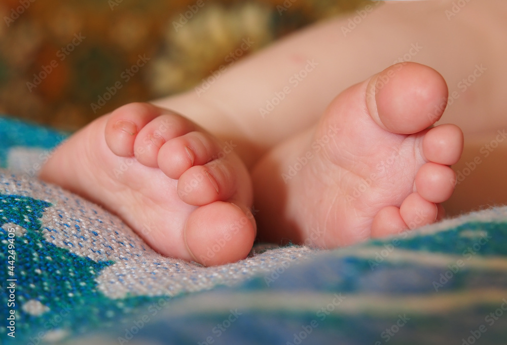 Babies feet on a blanket. Babies feet on a blanket.