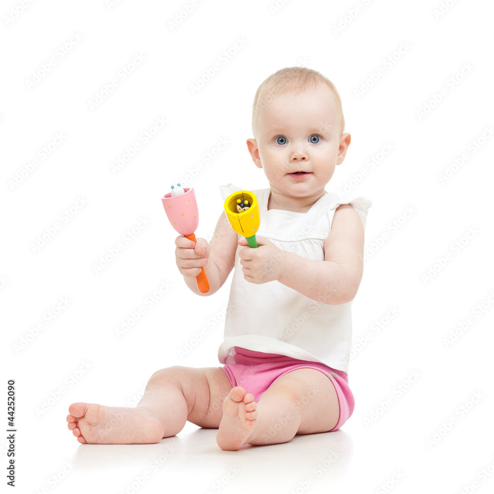 Baby girl with musical toys. Isolated on white background Baby girl with musical toys. Isolated on white background