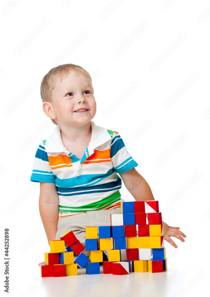 kid playing toy blocks isolated on white background kid playing toy blocks isolated on white background
