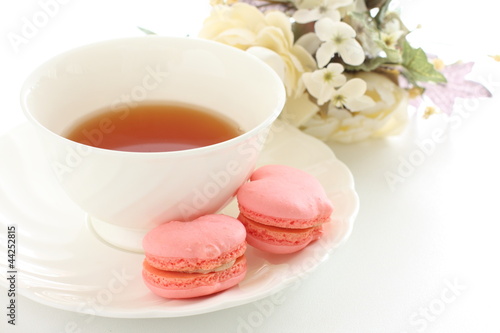 heart shaped macaron and English tea with copy space