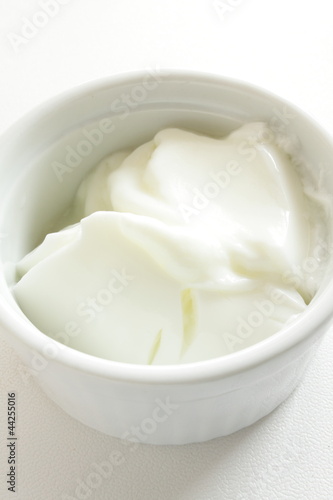 white plain Yogurt in white bowl