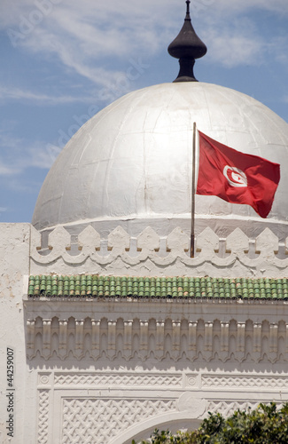 landmark large silver dome mosque and flag Sousse Tunisia Africa photo
