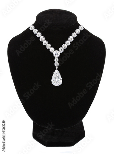 Diamond necklace on black mannequin isolated on white