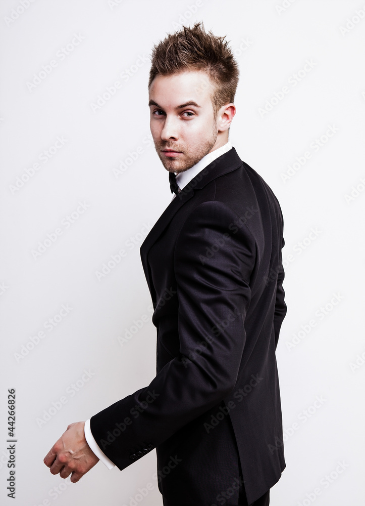 Fototapeta premium Elegant young handsome man. Studio fashion portrait.