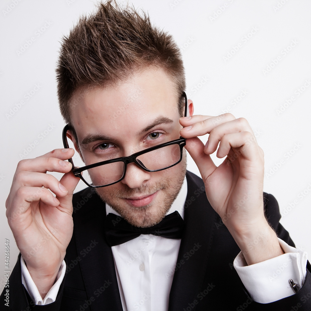 Portrait man in suit on grey backgroand Portrait man in suit on grey backgroand