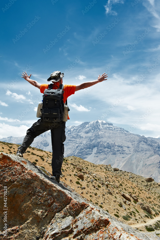 Tourist hiker with map in mountains Tourist hiker with map in mountains