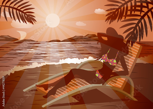 Girl in a hat and sunglasses getting tan on a beach