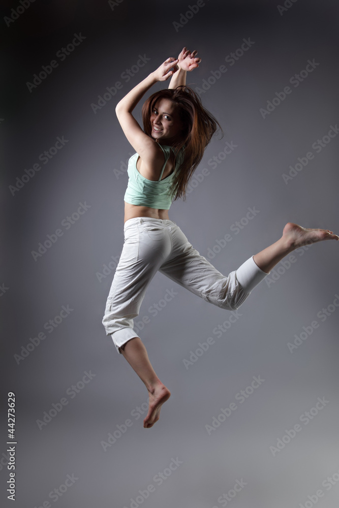 beauty girl dance on grey background