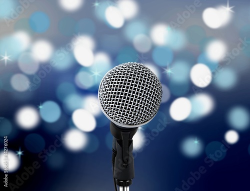 microphone with blur lights in background.