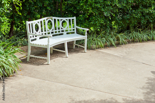 White bench in the garden