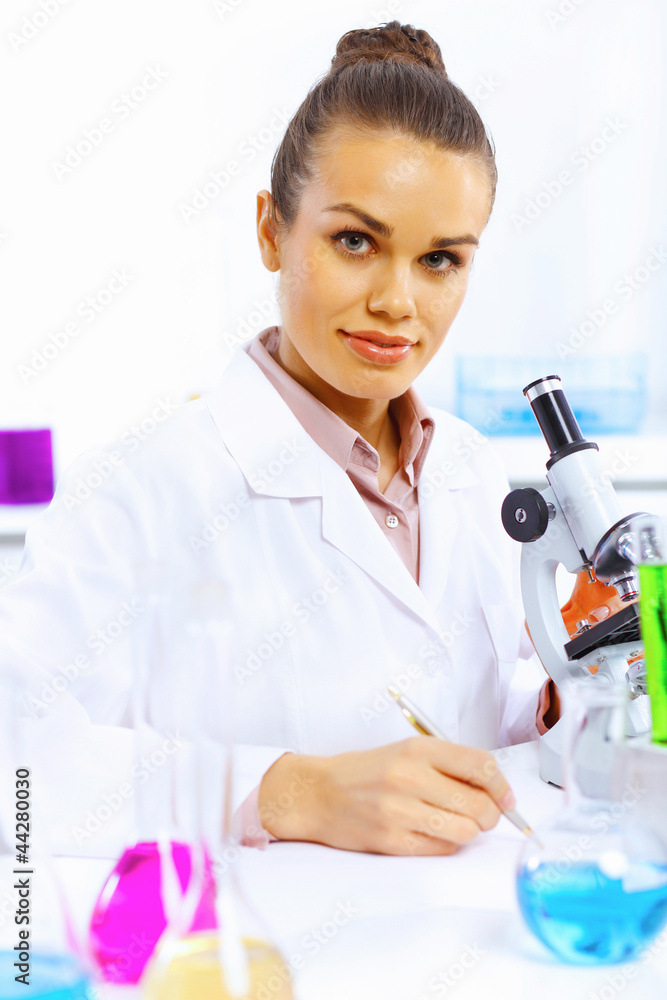 Young female scientist working in laboratory Young female scientist working in laboratory