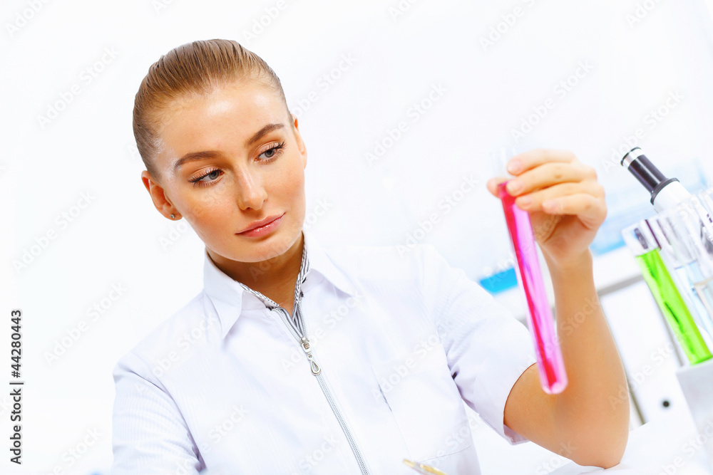 Young female scientist working in laboratory Young female scientist working in laboratory