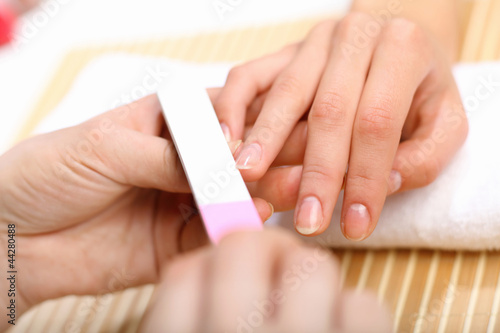 Woman is getting manicure