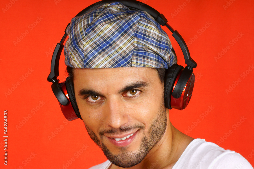 Fototapeta premium 30 years old man with beret and earphones