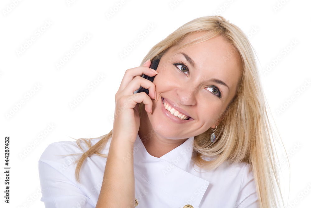 Young smiling beautiful woman-nurse talks by mobile phone Young smiling beautiful woman-nurse talks by mobile phone