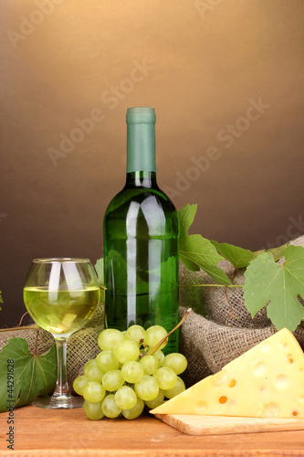 Bottle of great wine with glass and cheese