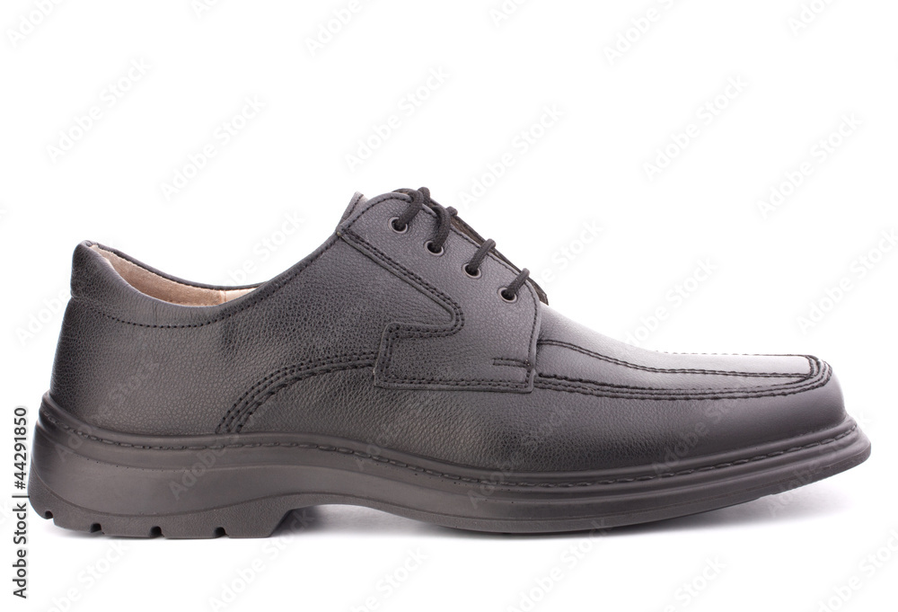 Black glossy man’s shoe with shoelaces