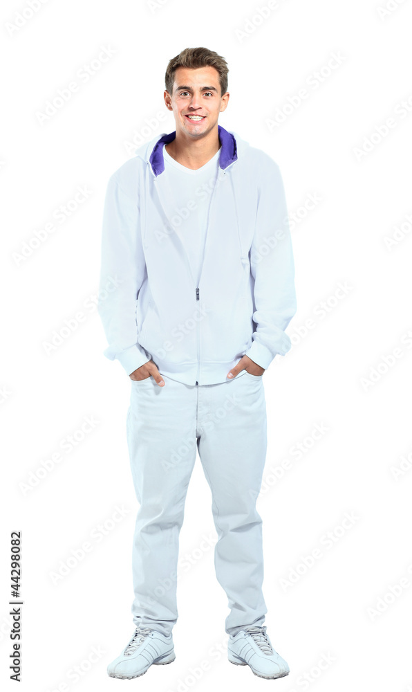 Happy smiling young man standing full length Happy smiling young man standing full length