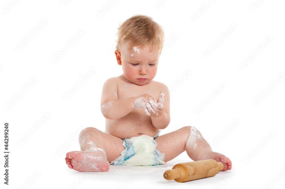 Little boy cooking with rolling pin Little boy cooking with rolling pin