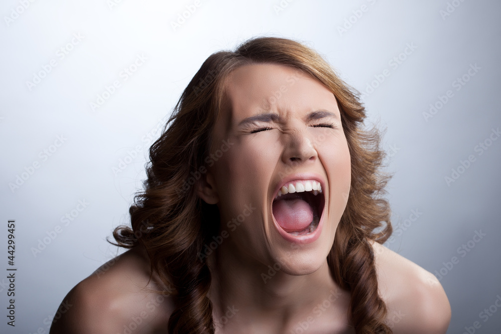 Young woman in stress cry loud Young woman in stress cry loud