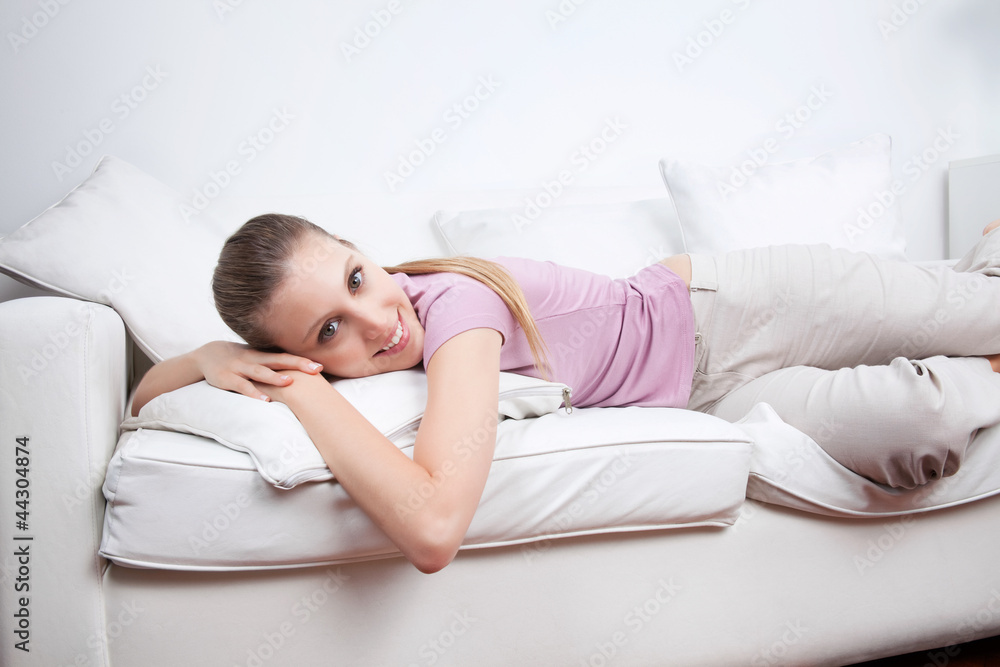 Young Woman Lying on Couch Young Woman Lying on Couch
