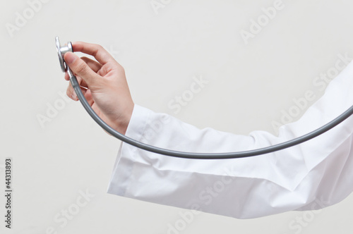Hand holding stethoscope