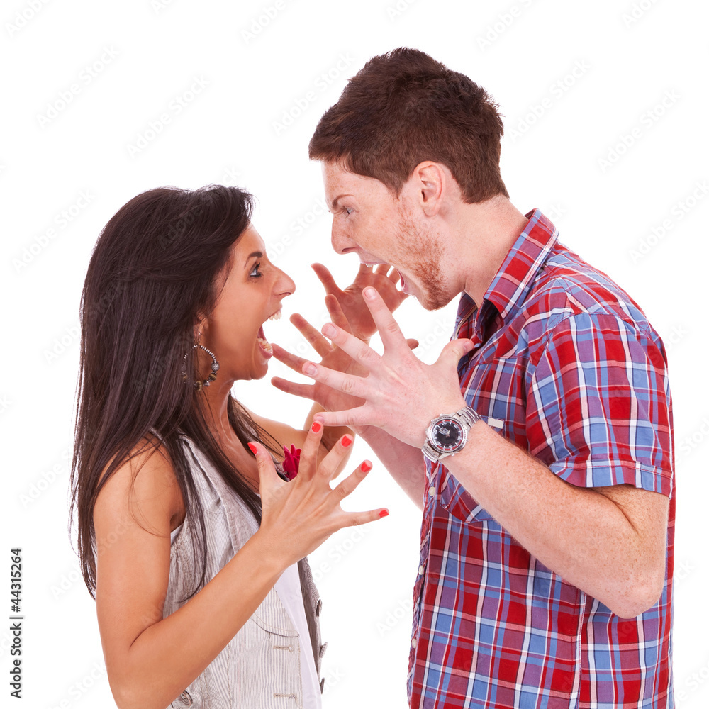 Young couple screaming violently at eachother Young couple screaming violently at eachother
