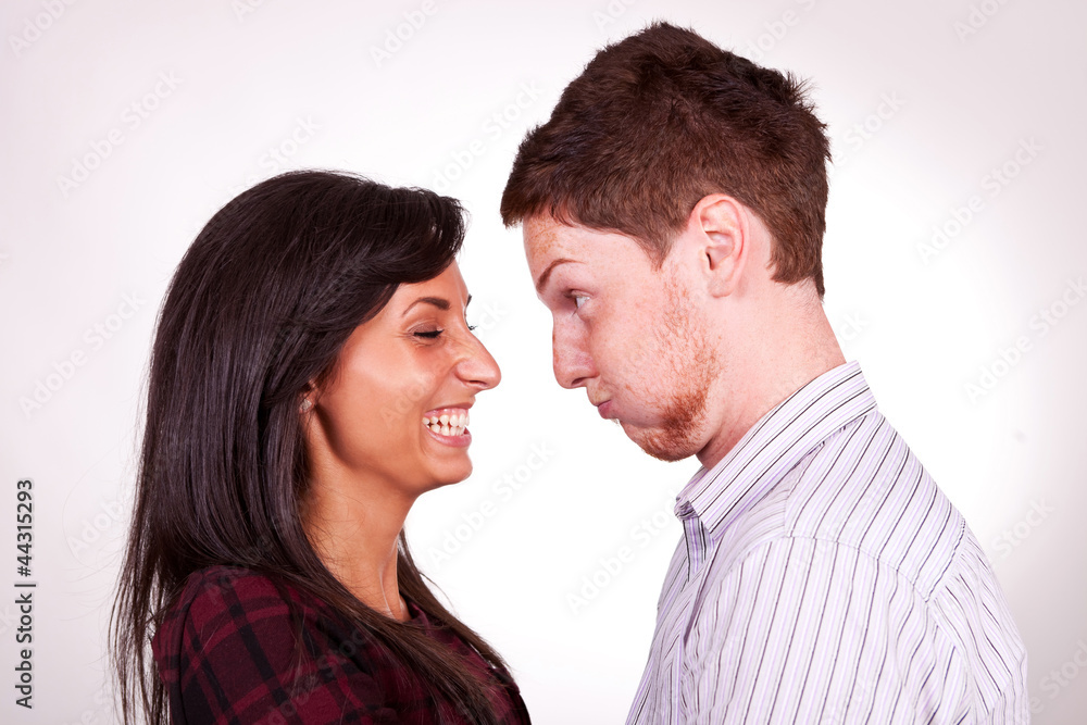 a young couple, man entertaining his girlfriend