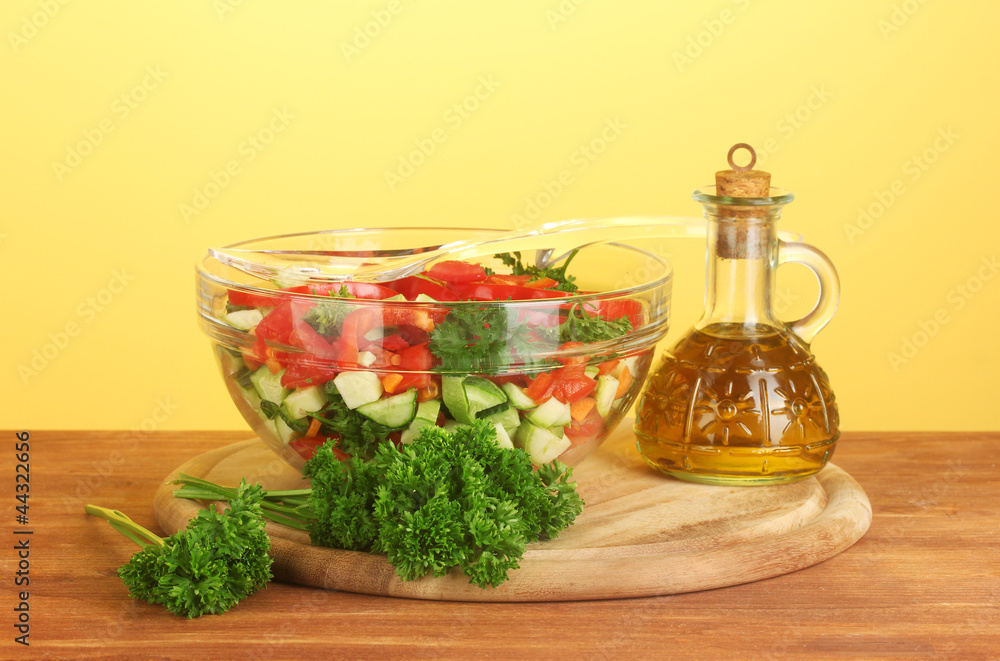 Fresh salad and oil on green background Fresh salad and oil on green background