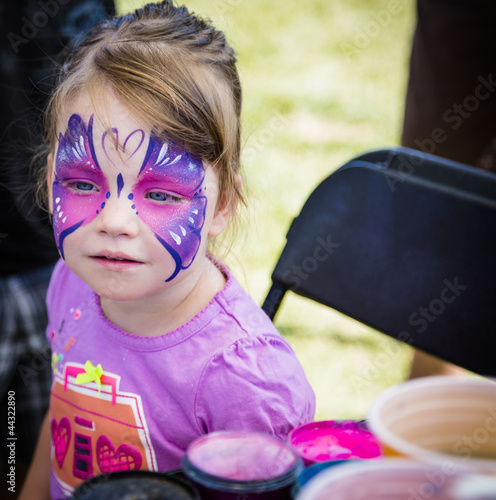 young girl with butterfly face paint