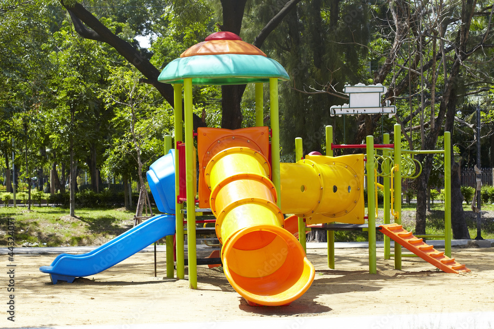 Complex playground set in well-maintained park Complex playground set in well-maintained park