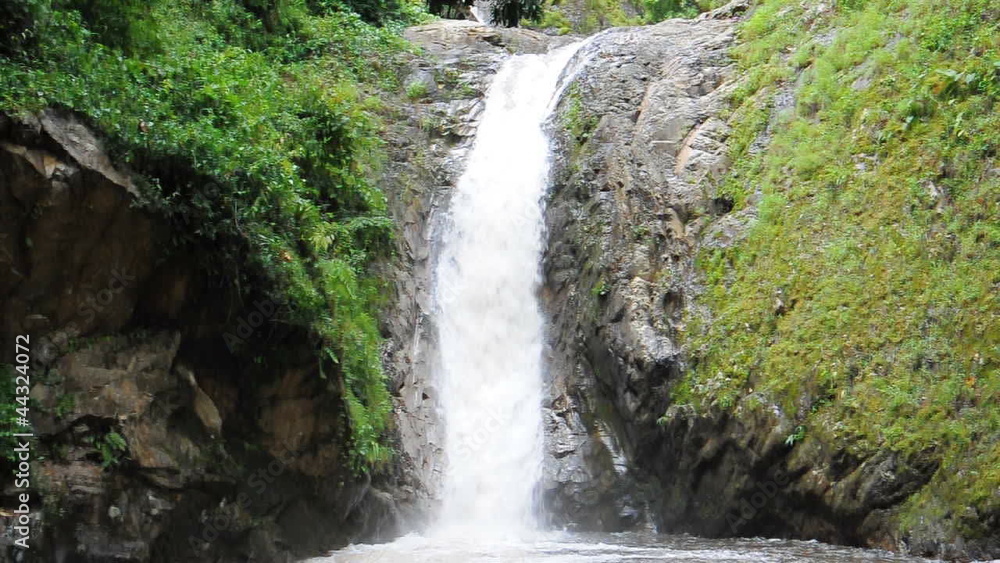 flowing waterfall in the jungle of Thailand flowing waterfall in the jungle of Thailand