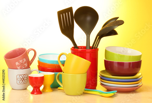 bright empty bowls  cups and kitchen utensils