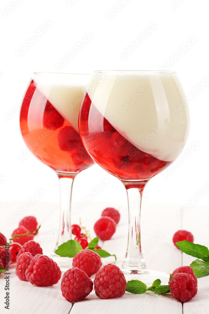 fruit jelly with berries in glasses on wooden table fruit jelly with berries in glasses on wooden table