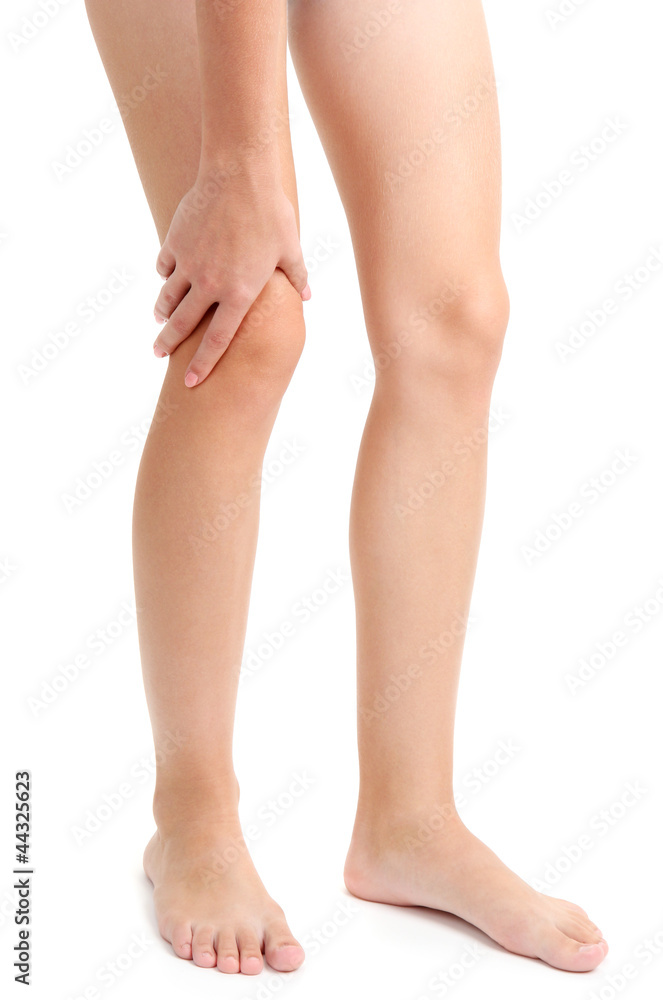 woman holding sore leg, isolated on white woman holding sore leg, isolated on white
