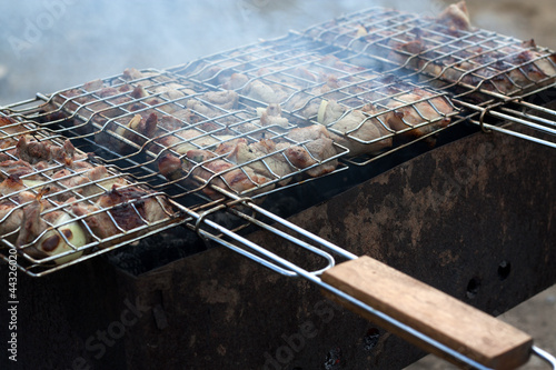 Chicken barbecue on grill.
