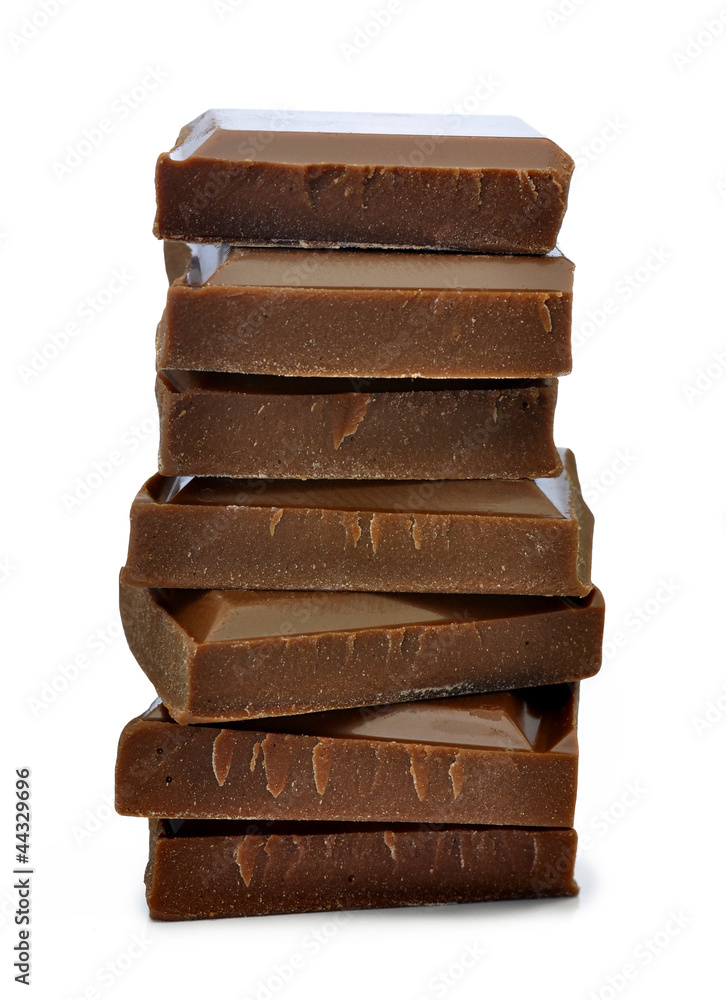 Stack of chocolate pieces on a white background Stack of chocolate pieces on a white background