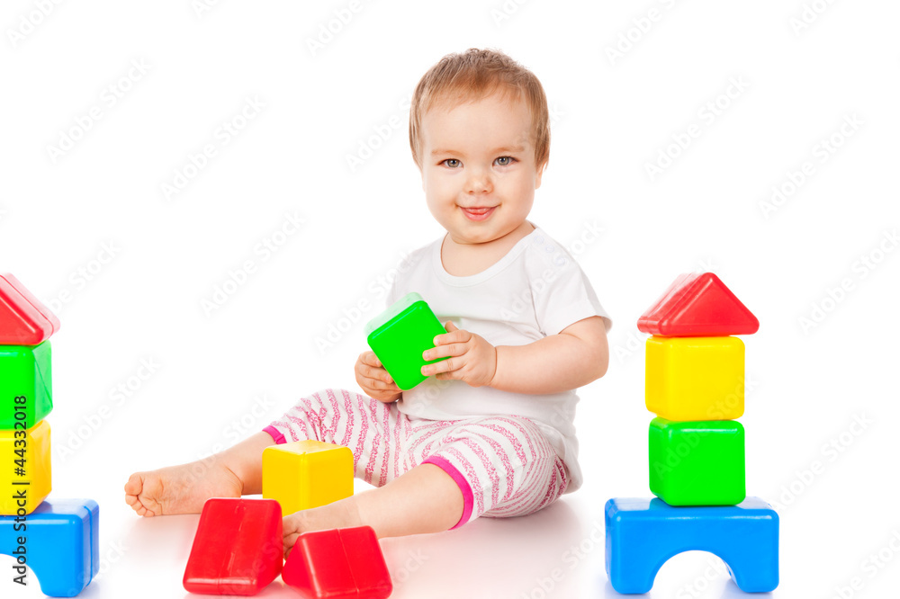 Smiling little girl with blocks, isolated on white Smiling little girl with blocks, isolated on white