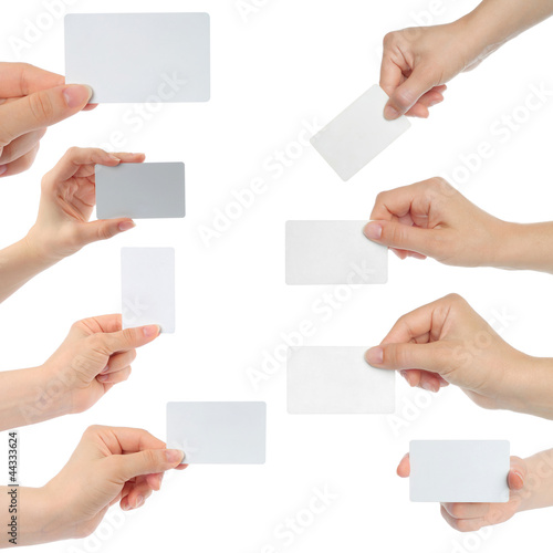 Hands hold business cards on white background