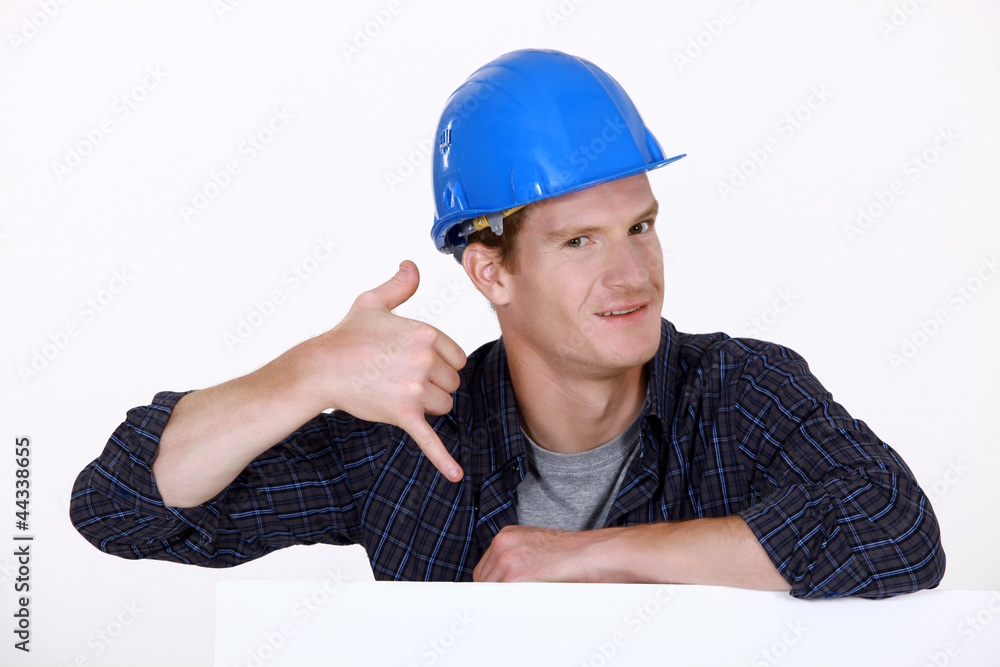 Manual worker making a phone shape with his hand Manual worker making a phone shape with his hand