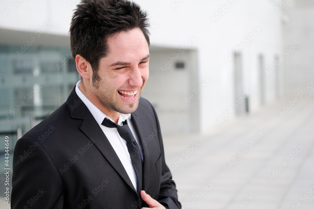 Portrait of a handsome young businessman laughing Portrait of a handsome young businessman laughing