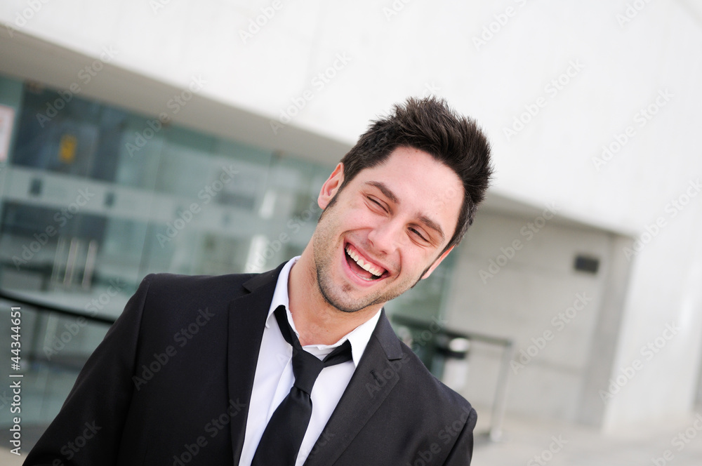 Portrait of a handsome young businessman laughing Portrait of a handsome young businessman laughing