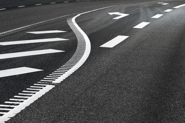 Asphjalt road with arrow sign